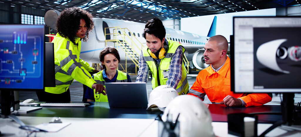 diverse team working on aircraft