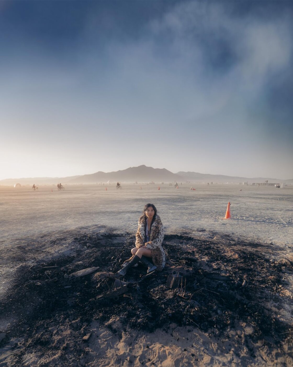 A person sitting in a pile of dirt  AI-generated content may be incorrect.