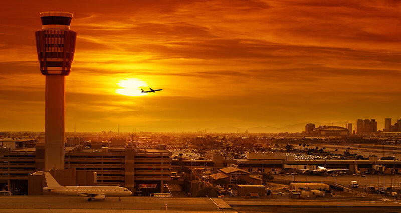 Airport control tower at sunset
