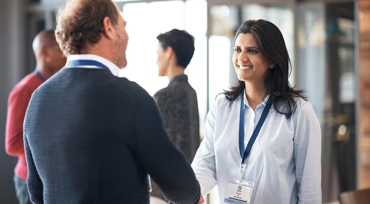 colleagues talking at conference