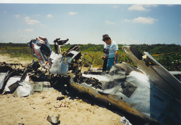 Odie with his father at the crash scene that took his brother's life.
