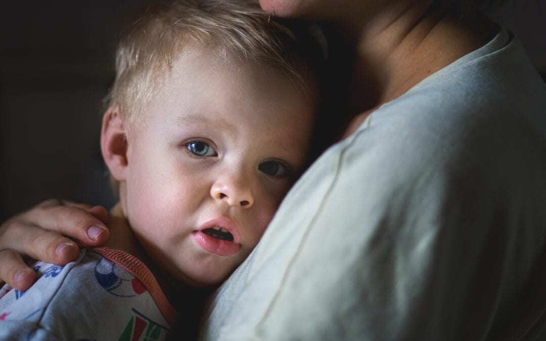 Bigstock a Tearful Little Boy Clings to