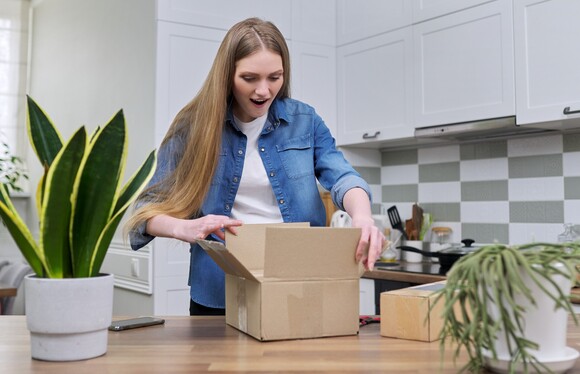 Happy woman opening a gift