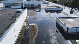 The Hidden Costs of Ignoring Minor Roof Ponding on Flat Commercial Roofs