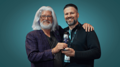 LEXRA Executive Director Bob Cooney Awards VR Bobble Award to Dave Myers at VR Arcade Summit in 2022
