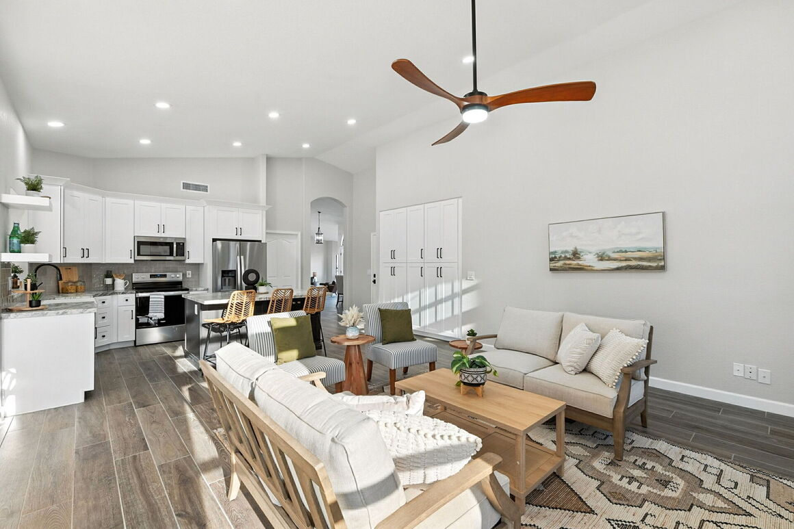 Whole-home renovation featuring an updated open-concept kitchen and living space